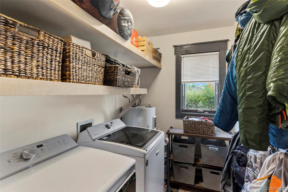 The laundry room area has enough space to hang all of your jackets and ski gear.