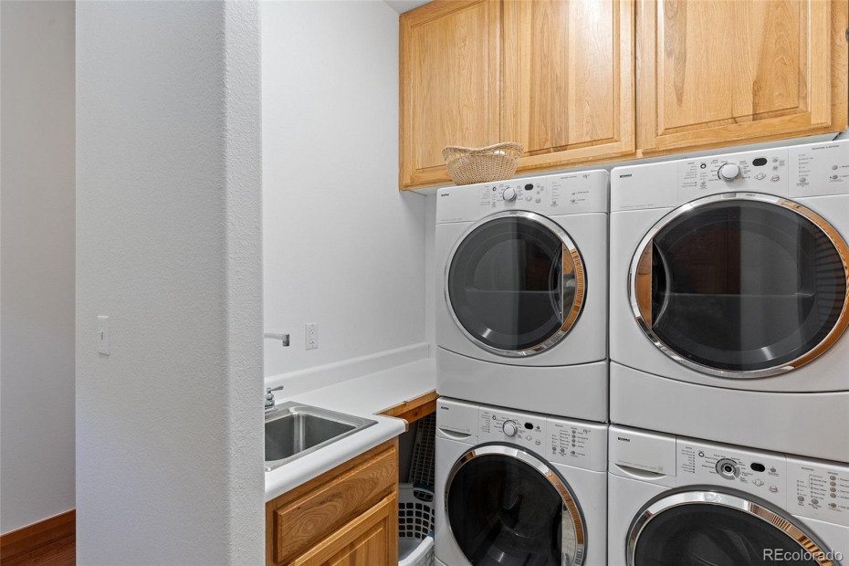 Main level laundry has 2 washers and 2 dryers