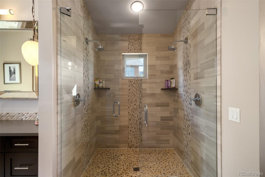 Primary bath with two vanities and soaking tub