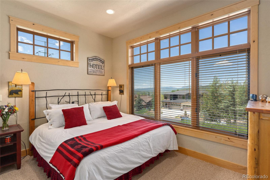 Main floor bedroom with views of the mountains.