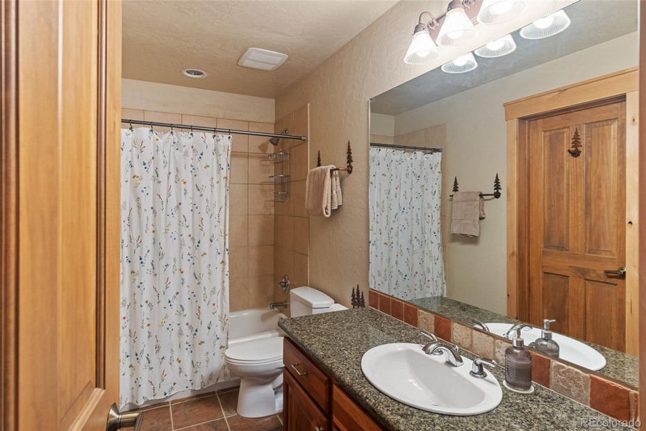 Lower level bathroom is convenient for the bedroom and the den.