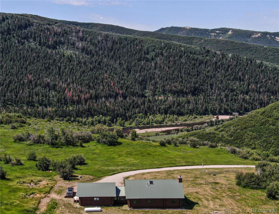 The home sits on a bench overlooking the Yampa River.
