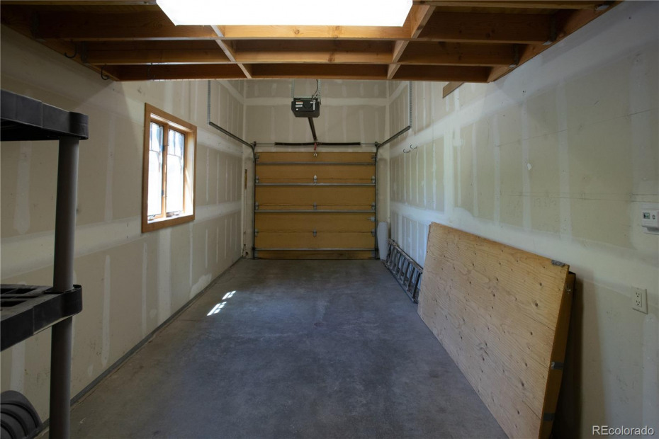 Heated 1-car garage with mezzanine storage above