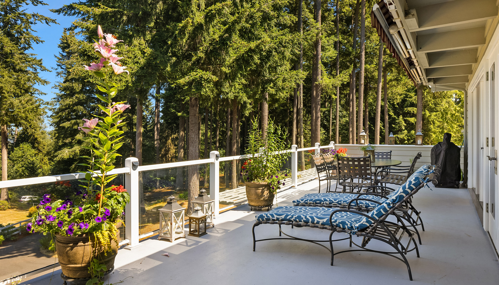 Enormous deck with retractable awning, glass panel railings, and sublime views!
